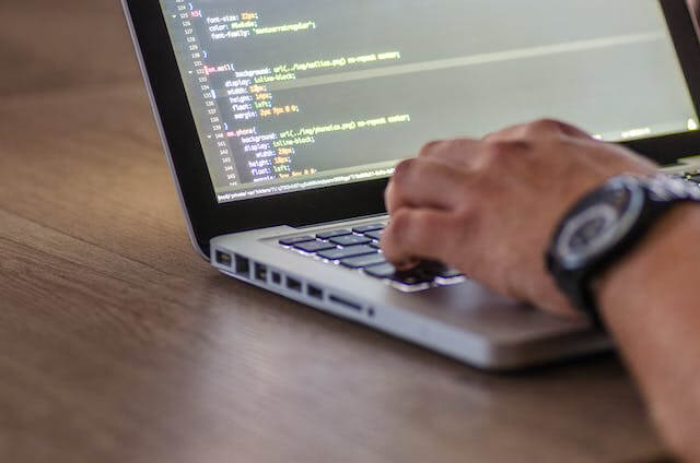 a man is dealing with some codes on the computer